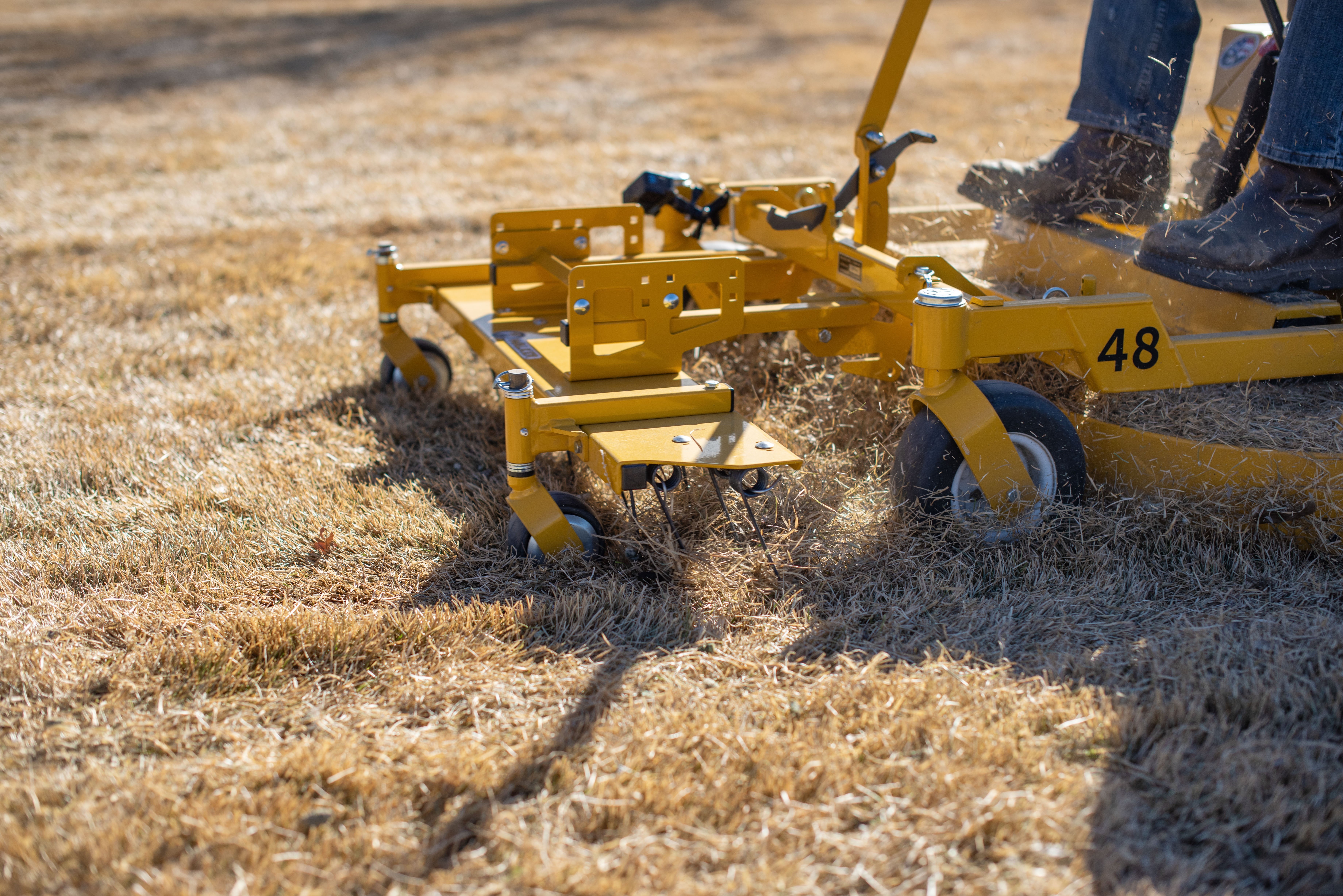 C23i Walker Mower with an A10 dethatcher attachment. 