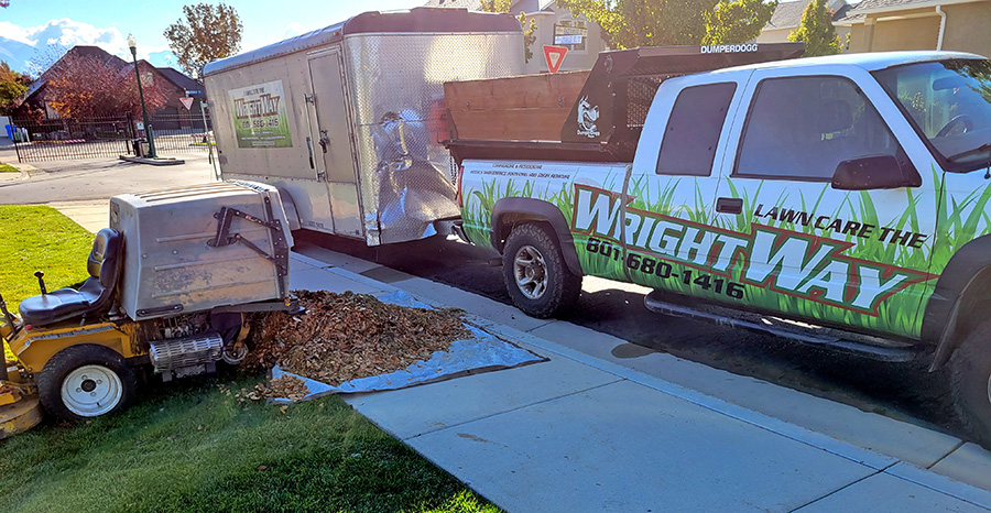 Crews have found that dumping
onto a tarp is the most efficient way to get clippings and leaves off of a lawn and into a truck bed.