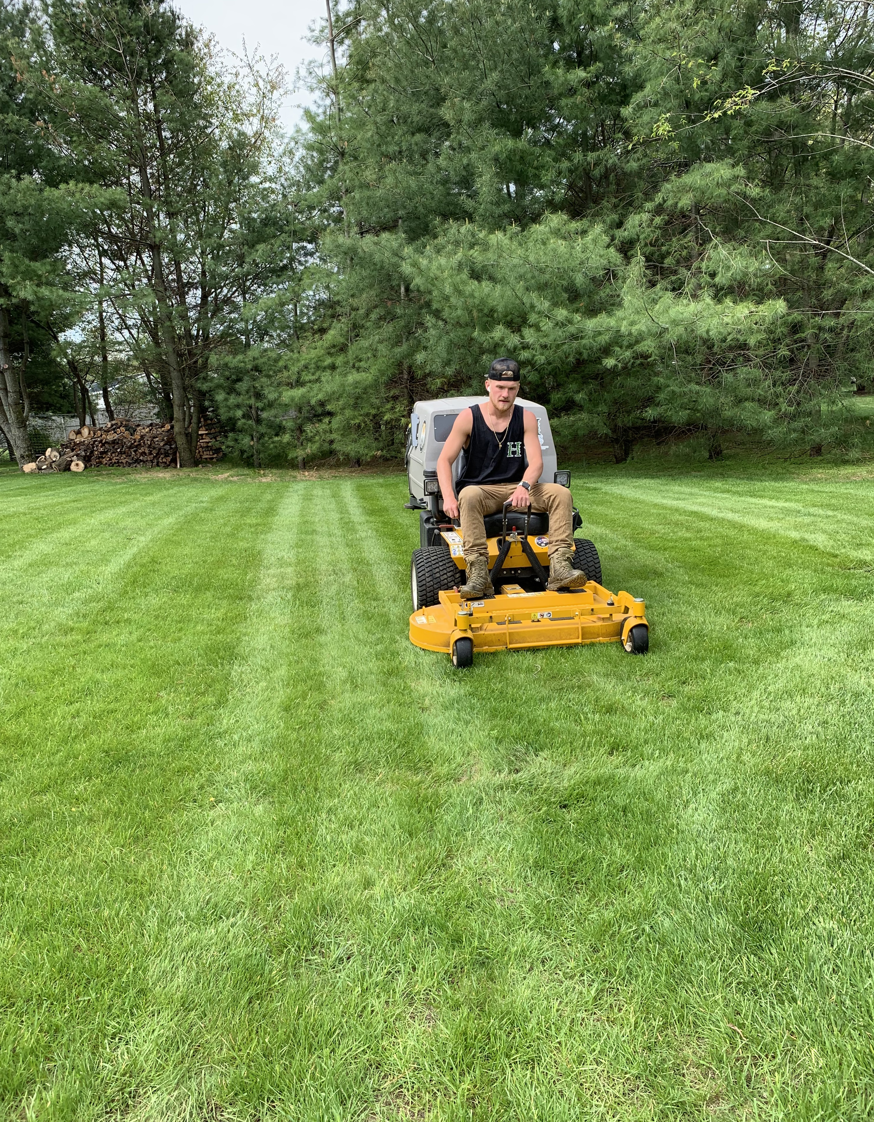 Jack Haraden mowing lawns