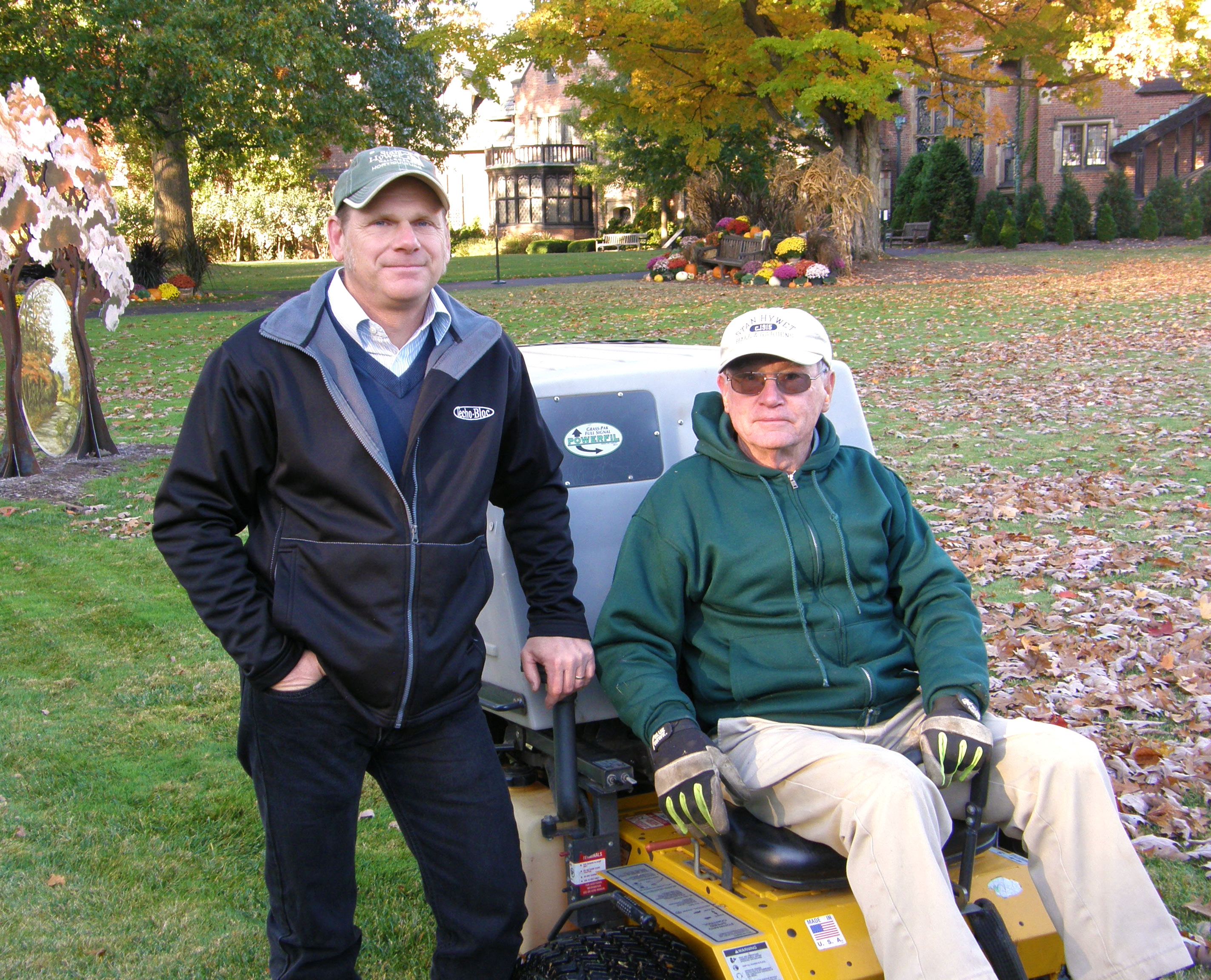 Tom Hrivnak and a volunteer with the Walker Mower